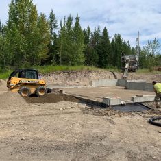 Bobcat Prepping foundation for concrete